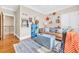 Fun-filled living room perfect for a playroom complete with hardwood floors and playful decor at 2382 Waverly Rd., Pawleys Island, SC 29585