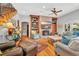Comfortable living room with a brick fireplace, hardwood floors, and stylish furnishings at 2382 Waverly Rd., Pawleys Island, SC 29585