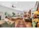 Bright and airy living room featuring an open layout, hardwood floors, and access to outdoor spaces at 2382 Waverly Rd., Pawleys Island, SC 29585