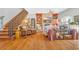 Inviting living room showcasing a fireplace, built-in bookshelves, and hardwood floors at 2382 Waverly Rd., Pawleys Island, SC 29585