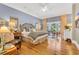 Serene bedroom with hardwood floors, elegant decor, and ample natural light at 2382 Waverly Rd., Pawleys Island, SC 29585