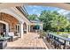 Expansive patio featuring an outdoor seating area, bar seating, and a glimpse of the lush backyard at 2382 Waverly Rd., Pawleys Island, SC 29585