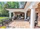 Outdoor patio with tiled flooring, BBQ, outdoor kitchen, ceiling fan, and comfortable seating at 2382 Waverly Rd., Pawleys Island, SC 29585