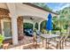 Inviting patio with ample seating, dining area, and a view of the beautifully landscaped backyard at 2382 Waverly Rd., Pawleys Island, SC 29585