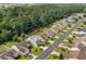 Aerial view of home shows location on quiet street with mature trees and manicured lawns at 2448 Whetstone Ln., Myrtle Beach, SC 29579