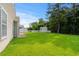 View of the home's large backyard featuring mature trees, a shed and a privacy fence at 2448 Whetstone Ln., Myrtle Beach, SC 29579