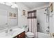Cozy bathroom features a vanity, toilet, and shower with decorative accents at 2448 Whetstone Ln., Myrtle Beach, SC 29579