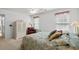 Serene bedroom showcasing a floral bedspread, natural light, and neutral decor at 2448 Whetstone Ln., Myrtle Beach, SC 29579