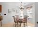 Eat-in kitchen with modern chandelier and decorative wall art above the dining table at 2448 Whetstone Ln., Myrtle Beach, SC 29579