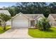 Charming single-story home featuring a well-manicured lawn and two-car garage at 2448 Whetstone Ln., Myrtle Beach, SC 29579