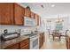 Well-lit kitchen features stainless steel appliances and adjacent eat-in dining area at 2448 Whetstone Ln., Myrtle Beach, SC 29579