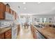 Spacious kitchen with white appliances, wood cabinets and connecting breakfast area at 2448 Whetstone Ln., Myrtle Beach, SC 29579