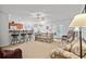 Spacious living room open to the kitchen, featuring a breakfast bar and comfortable seating at 2448 Whetstone Ln., Myrtle Beach, SC 29579