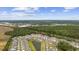 Aerial view of a new residential community with a pond and well-maintained landscaping at 2475 Blue Crane Circle # 106, Myrtle Beach, SC 29577