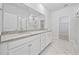 Bright bathroom features a double vanity with granite countertop, undermount sinks, and a large mirror at 2475 Blue Crane Circle # 106, Myrtle Beach, SC 29577