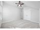 Neutral colored bedroom featuring plush carpet, ceiling fan, and a closet at 2475 Blue Crane Circle # 106, Myrtle Beach, SC 29577