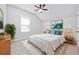 Comfortable bedroom featuring plush carpet, a ceiling fan, and bright natural light at 2475 Blue Crane Circle # 106, Myrtle Beach, SC 29577