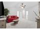 Spacious bonus room with plush carpet, ceiling fan, and a cozy sofa at 2475 Blue Crane Circle # 106, Myrtle Beach, SC 29577