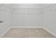 Walk-in closet with carpet floor, white walls, and wire shelving ready for all your storage needs at 2475 Blue Crane Circle # 106, Myrtle Beach, SC 29577