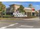 Exterior shot of a brick Market Common building with a well-manicured lawn at 2475 Blue Crane Circle # 106, Myrtle Beach, SC 29577