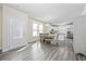 Open dining area with wood floors, table and chairs, and white door in a modern-style home at 2475 Blue Crane Circle # 106, Myrtle Beach, SC 29577