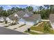 Charming two-story homes feature garages and landscaped yards in a serene community setting at 2475 Blue Crane Circle # 106, Myrtle Beach, SC 29577