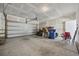 Spacious two-car garage with unfinished drywall and a blue recycling bin at 2475 Blue Crane Circle # 106, Myrtle Beach, SC 29577