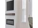 Close up view of modern fireplace and windows at 2475 Blue Crane Circle # 106, Myrtle Beach, SC 29577