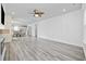Open-concept living space with wood floors and abundant natural light at 2475 Blue Crane Circle # 106, Myrtle Beach, SC 29577