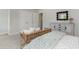 This bedroom features a mirror above a dresser next to the bed and closet doors at 251 Konik St., Conway, SC 29526