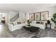 Inviting living room with two white sofas, stylish decor, soft textures, and a cozy atmosphere for gatherings at 251 Konik St., Conway, SC 29526