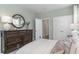 Comfortable main bedroom featuring a wooden dresser, ample closet space, soft carpeting, and inviting textures at 251 Konik St., Conway, SC 29526