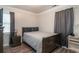 Bedroom with hardwood floors, curtains, a ceiling fan, and a side table with a lamp at 2510 Redwood St., Georgetown, SC 29440