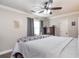 Bedroom with crown molding, ceiling fan, hardwood floors, curtains, and a window with natural light at 2510 Redwood St., Georgetown, SC 29440