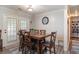 Cozy dining room with a large wooden table and seating for eight at 2510 Redwood St., Georgetown, SC 29440