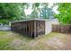 Exterior view of home featuring screened-in patio, vinyl siding, and fenced in backyard at 2510 Redwood St., Georgetown, SC 29440