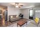 Bright living room with hardwood floors, ceiling fan, neutral walls, and a workstation at 2510 Redwood St., Georgetown, SC 29440