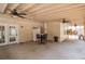 Large patio with ceiling fans, table and chairs, refrigerator and convenient access to the backyard at 2510 Redwood St., Georgetown, SC 29440