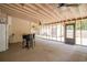 Covered patio area with ceiling fans and access to the backyard through a framed doorway at 2510 Redwood St., Georgetown, SC 29440