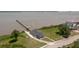 An aerial view of the property featuring water access, pier, and a quaint building by the waterfront at 2609 Seaport Circle, Georgetown, SC 29440