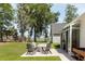Serene backyard featuring a patio, seating, and lush landscaping at 2609 Seaport Circle, Georgetown, SC 29440