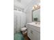Bright bathroom featuring a shower with a patterned curtain, a white vanity, and wood-look flooring at 2609 Seaport Circle, Georgetown, SC 29440
