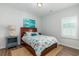Inviting bedroom with colorful bedding, wooden frame, and bright window at 2609 Seaport Circle, Georgetown, SC 29440