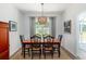 Cozy dining area with stylish light fixture, seating for six, and access to the backyard at 2609 Seaport Circle, Georgetown, SC 29440