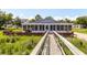 Exterior elevation of a screened-in back porch with walkway featuring waterfront access at 2609 Seaport Circle, Georgetown, SC 29440