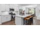 Modern kitchen featuring stainless steel appliances, white cabinets, and island with seating at 2609 Seaport Circle, Georgetown, SC 29440