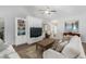 Bright living room with built-in shelves, ceiling fan, and cozy furniture arrangement at 2609 Seaport Circle, Georgetown, SC 29440