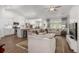Open-concept living room seamlessly connected to a modern kitchen with stainless steel appliances at 2609 Seaport Circle, Georgetown, SC 29440