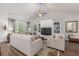 Inviting living room with vaulted ceiling, built-in cabinets, comfortable seating, and hardwood floors at 2609 Seaport Circle, Georgetown, SC 29440
