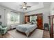 This is a bright main bedroom with tray ceiling, ceiling fan, and a wall of built-in cabinets at 2609 Seaport Circle, Georgetown, SC 29440